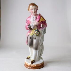 Elegant Pink and White Porcelain Figurine